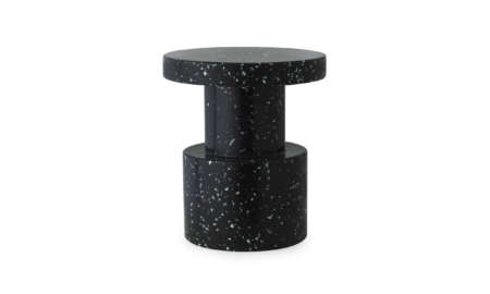 Product shot of the Bit Stool in black terrazzo finish, isolated on a white background.
