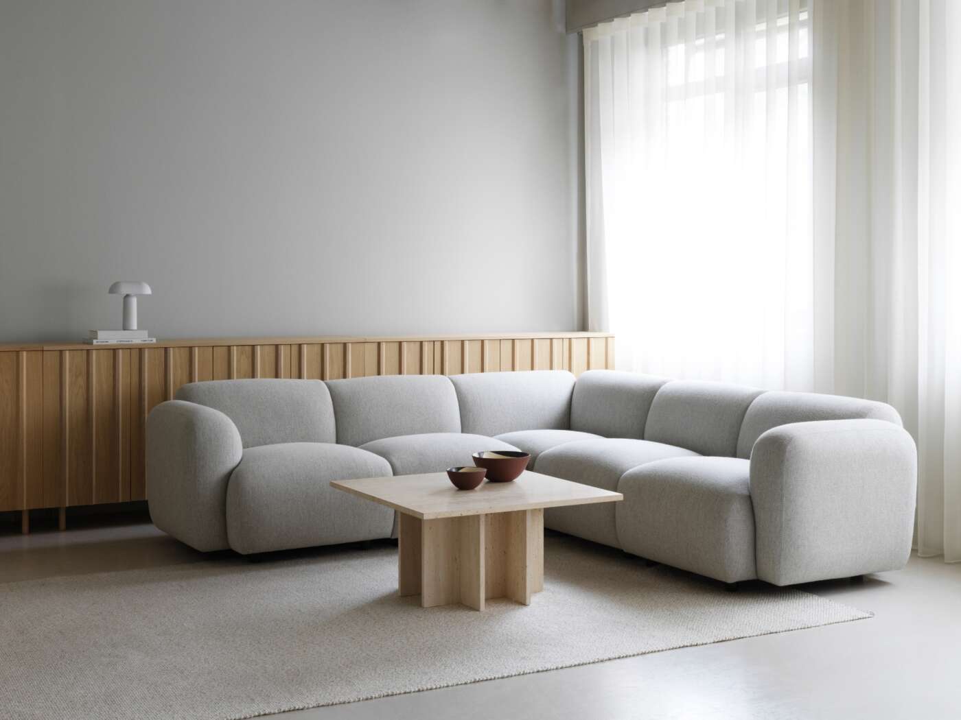 Polli recycled plastic rug styled in a modern Scandinavian living room
